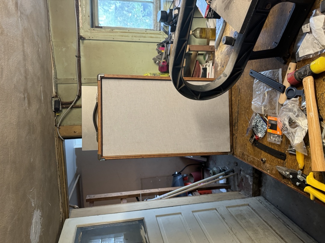 The cabinet standing in the workshop doorway