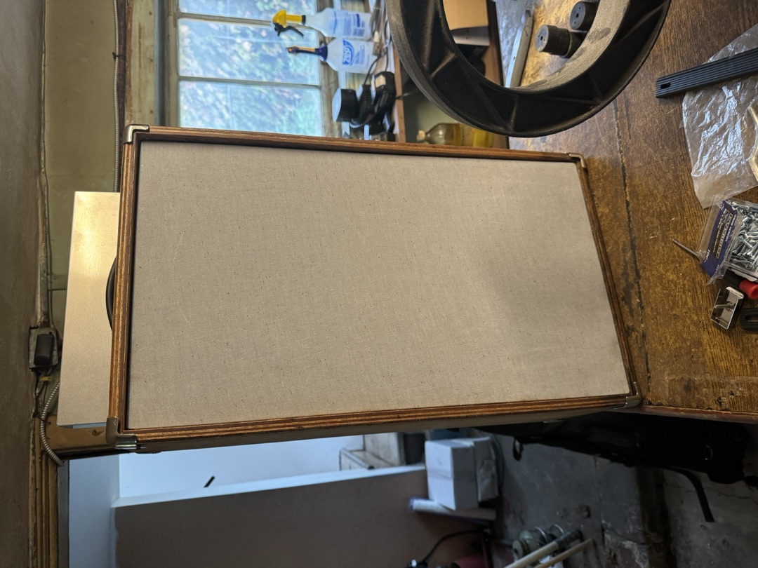 The cabinet face on, grille cloth stretched and even