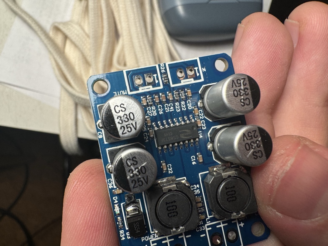 A small circuit board held in hand