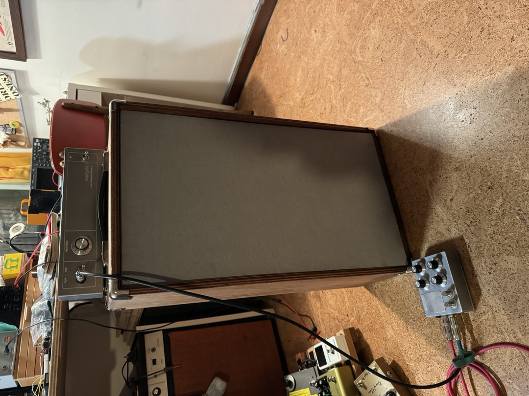 The finished amp in the room, a pedal on the floor in front of it