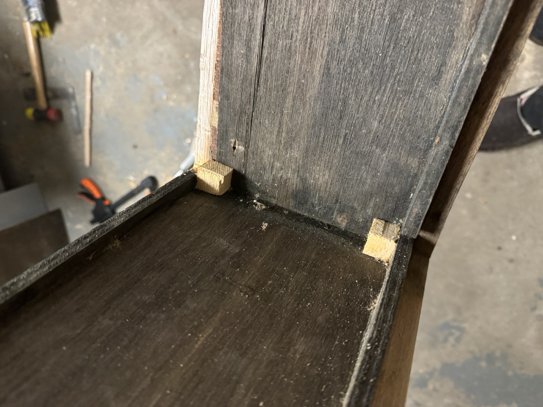 A cabinet joint from inside, splines set into the corner