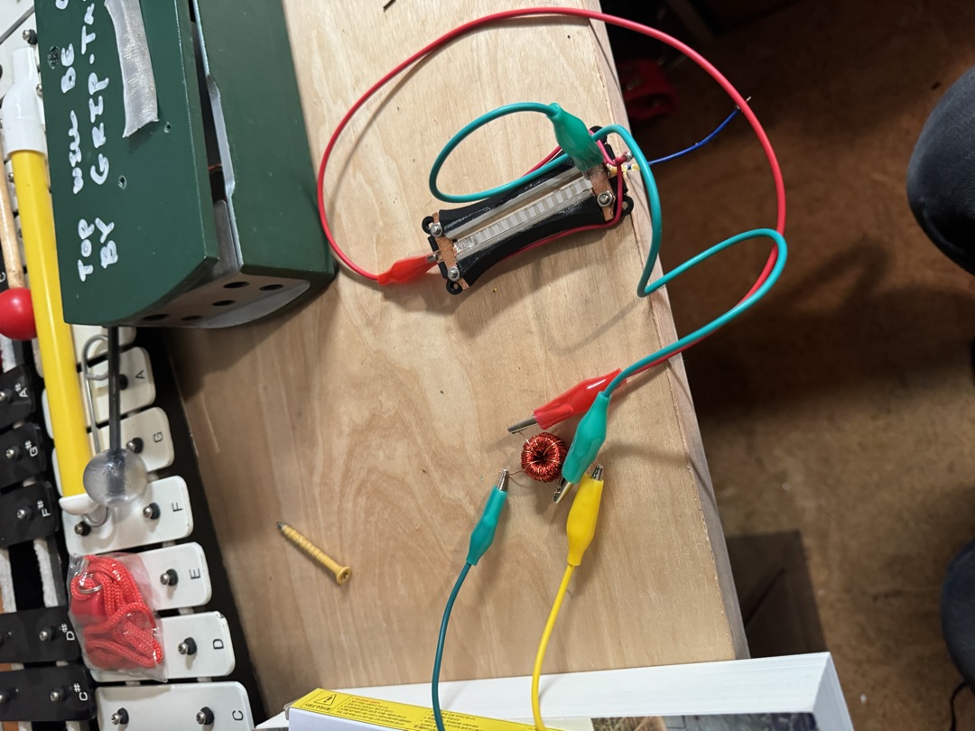The transformer under test, clip leads attached