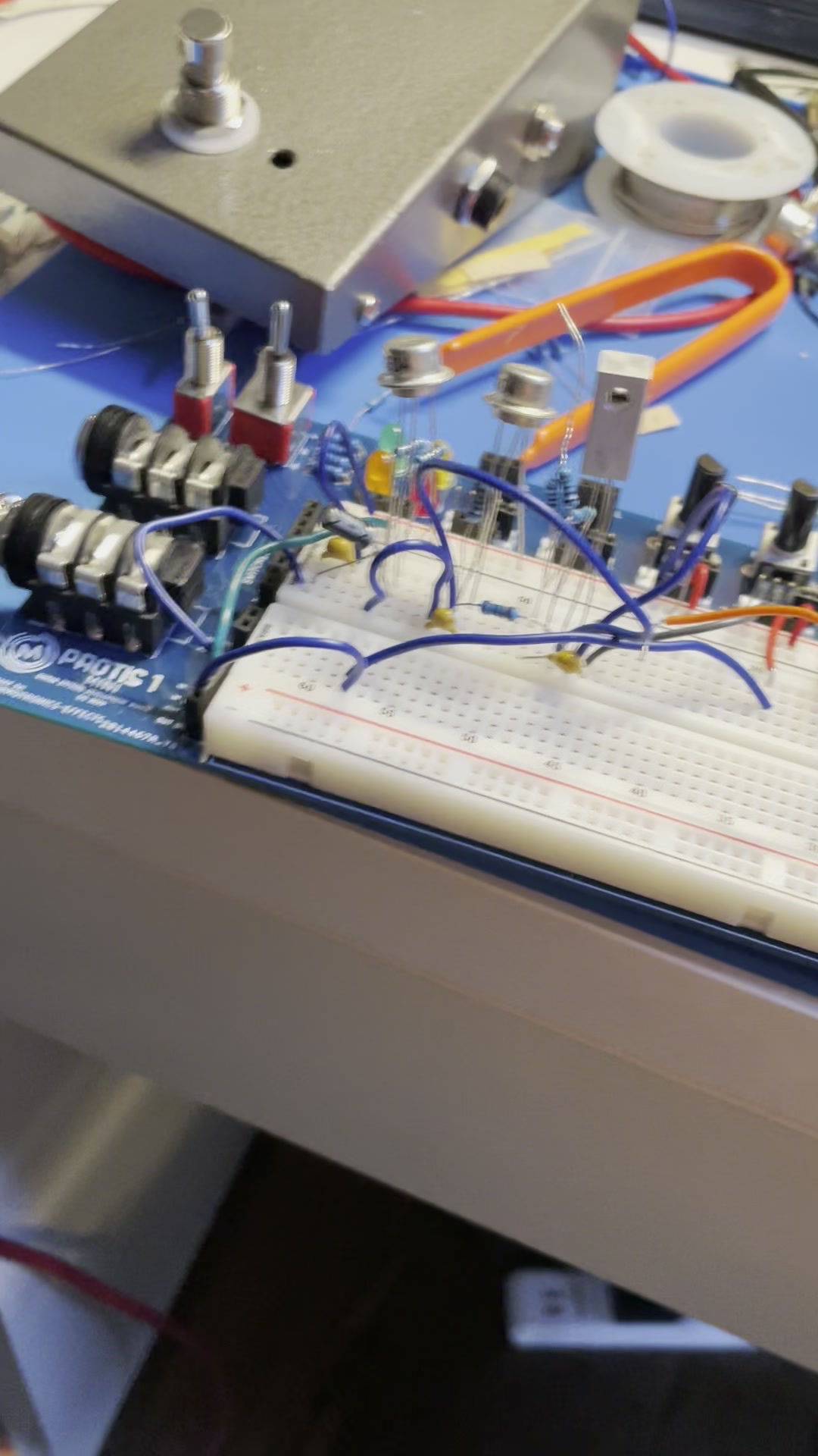 Stage Kiss circuit breadboarded beside its enclosure