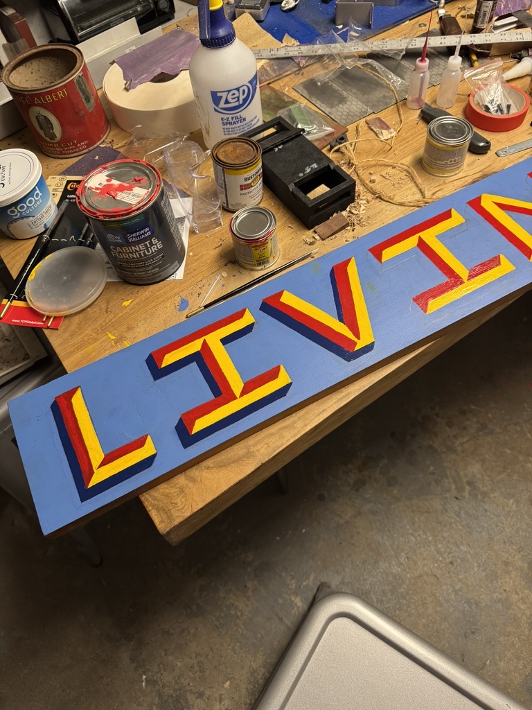The finished lettering, navy shadows giving each letter its depth