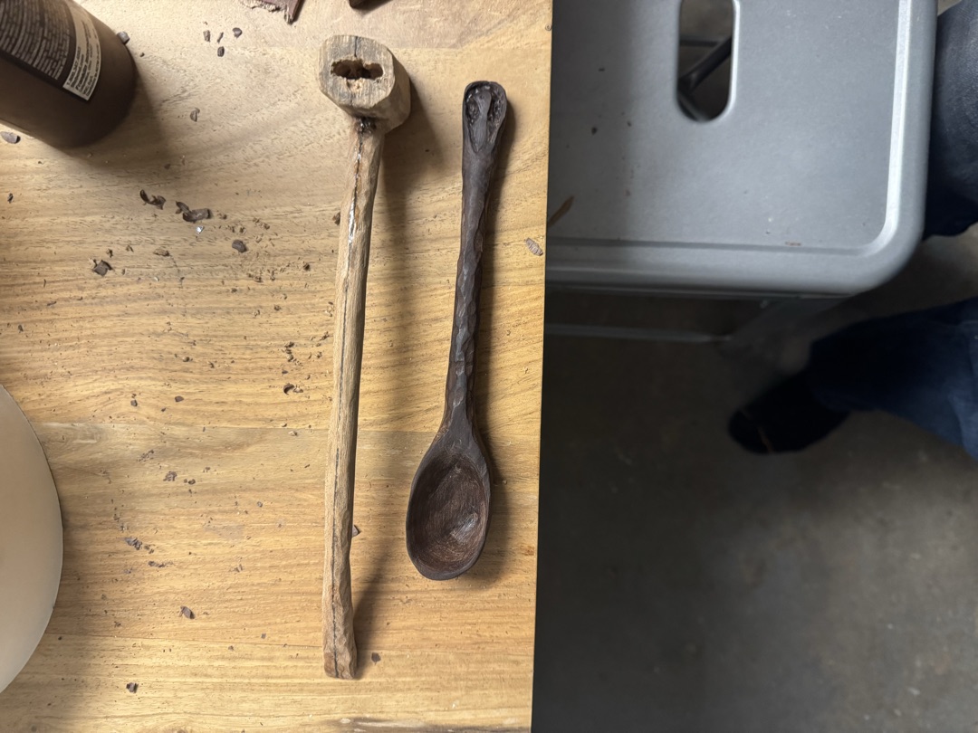 The pipe on the bench alongside the spoon, both mid-build